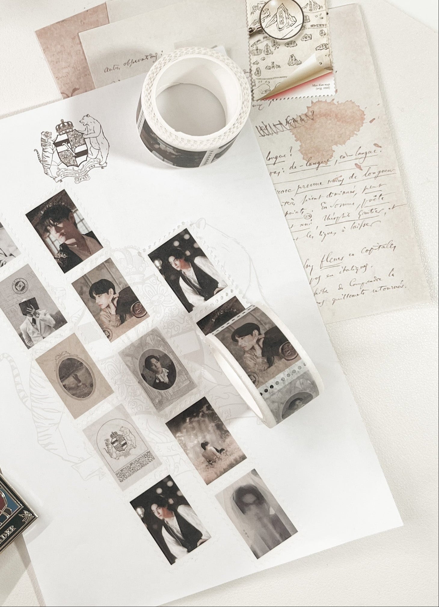 Washi tape and photo cards laid out on paper